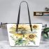 A watercolor illustration of dragonfly with sunflowers leather tote bag