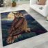 An owl perched on a branch in front of a moonlit landscape area rugs carpet