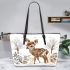 Baby deer in the snow leather totee bag