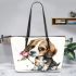 Beagle puppy holding a pink rose in its mouth leather tote bag