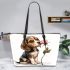 Beagle puppy holding a pink rose in its mouth leather tote bag