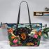 Black and tan dachshund dog surrounded by colorful tulips leather tote bag