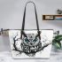 Black and white owl with bright teal eyes leather tote bag