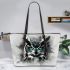 Black and white owl with turquoise highlights leather tote bag