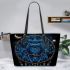 Blue owl sitting on an intricate dreamcatcher leather tote bag
