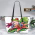 Colorful cartoon tree frog with lily flower leaather tote bag