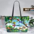 Colorful frogs hanging from tree branches in the jungle leaather tote bag