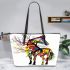Colorful horse with tree branches growing from its body leather tote bag