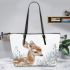 Cute baby deer in the snow leather totee bag