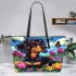 Cute black and tan dachshund in the garden with colorful tulips leather tote bag