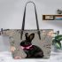 Cute black rabbit with pink collar leather tote bag