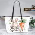 Cute bunny sitting on top of an carrot hello spring leather tote bag