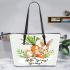 Cute bunny sitting on top of an carrot hello spring leather tote bag