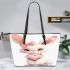 Cute cartoon bunny with a pink bow holding a heart leather tote bag