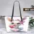 Cute cartoon bunny with a pink bow holding a heart leather tote bag