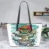 Cute cartoon frog eating ramen shown in a full body shot leaather tote bag