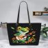 Cute cartoon frog playing guitar in a simple flat style design leaather tote bag