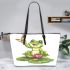 Cute cartoon frog sitting on a lily pad leaather tote bag