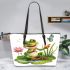 Cute cartoon frog sitting on a lily pad smiling with his legs crossed leaather tote bag