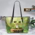 Cute cartoon frog sitting on a tree stump leaather tote bag
