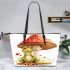 Cute cartoon frog sitting under an amanita muscaria mushroom leaather tote bag