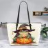 Cute cartoon frog wearing a witch hat sitting on a pumpkin leaather tote bag