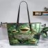 Cute cartoon green frog sitting on top of a bowl leaather tote bag