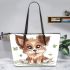 Cute cartoon puppy sits on the ground with its paws spread leather tote bag