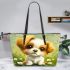 Cute cartoon puppy sitting on the grass leather tote bag