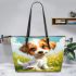 Cute cartoon puppy sitting on the grass leather tote bag