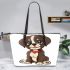 Cute cartoon puppy sitting with red collar leather tote bag