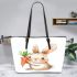 Cute cartoon rabbit holding a carrot leather tote bag