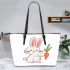 Cute cartoon rabbit holding a carrot in a simple leather tote bag