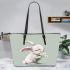 Cute cartoon rabbit holding daisies leather tote bag