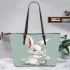 Cute cartoon rabbit holding daisies leather tote bag