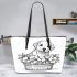 Cute cartoon style labrador puppy sitting in flower basket leather tote bag