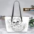 Cute cartoon style puppy sitting in flower basket leather tote bag