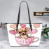 Cute chihuahua puppy inside a pink teacup with candy hearts leather tote bag