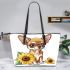 Cute chihuahua puppy with big eyes sitting next to sunflower leather tote bag