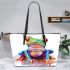 Cute colorful frog sitting on water leaather tote bag