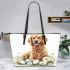 Cute golden retriever with easter eggs and white daisies leather tote bag