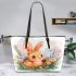 Cute happy baby bunny with big eyes sitting leather tote bag