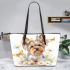 Cute little yorkshire terrier with long hair and bows in her ears leather tote bag