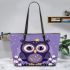 Cute owl cartoon with big eyes and yellow stars on its head leather tote bag