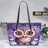 Cute owl cartoon with big eyes and yellow stars on its head leather tote bag