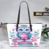 Cute owl sitting on books in pink and blue colors with flowers leather tote bag