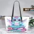 Cute owl sitting on books in pink and blue colors with flowers leather tote bag