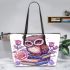 Cute owl sitting on books surrounded by pink roses leather tote bag