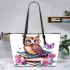 Cute owl sitting on books surrounded by pink roses leather tote bag