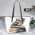 Cute owl sitting on top of books leather tote bag